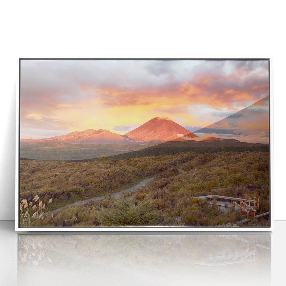Framed wall art featuring a vibrant volcanic landscape design with rich colors in an acrylic finish, showcasing dramatic mountains and swirling clouds. Ideal for adding a striking focal point to modern home decor.