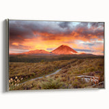 Framed canvas wall art depicting a vibrant volcanic landscape with dramatic colors and intricate details, set against a sleek silver frame for modern decor.