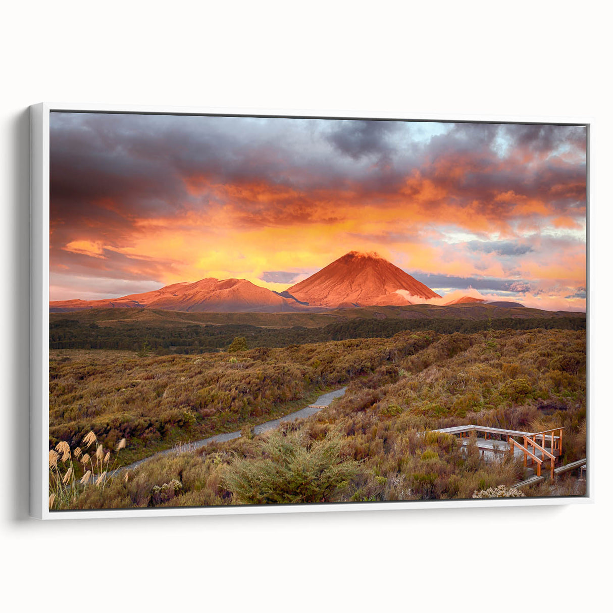 Framed canvas wall art featuring a vibrant volcano landscape design, set against a white background, showcasing bold colors and dynamic textures, perfect for home decor.