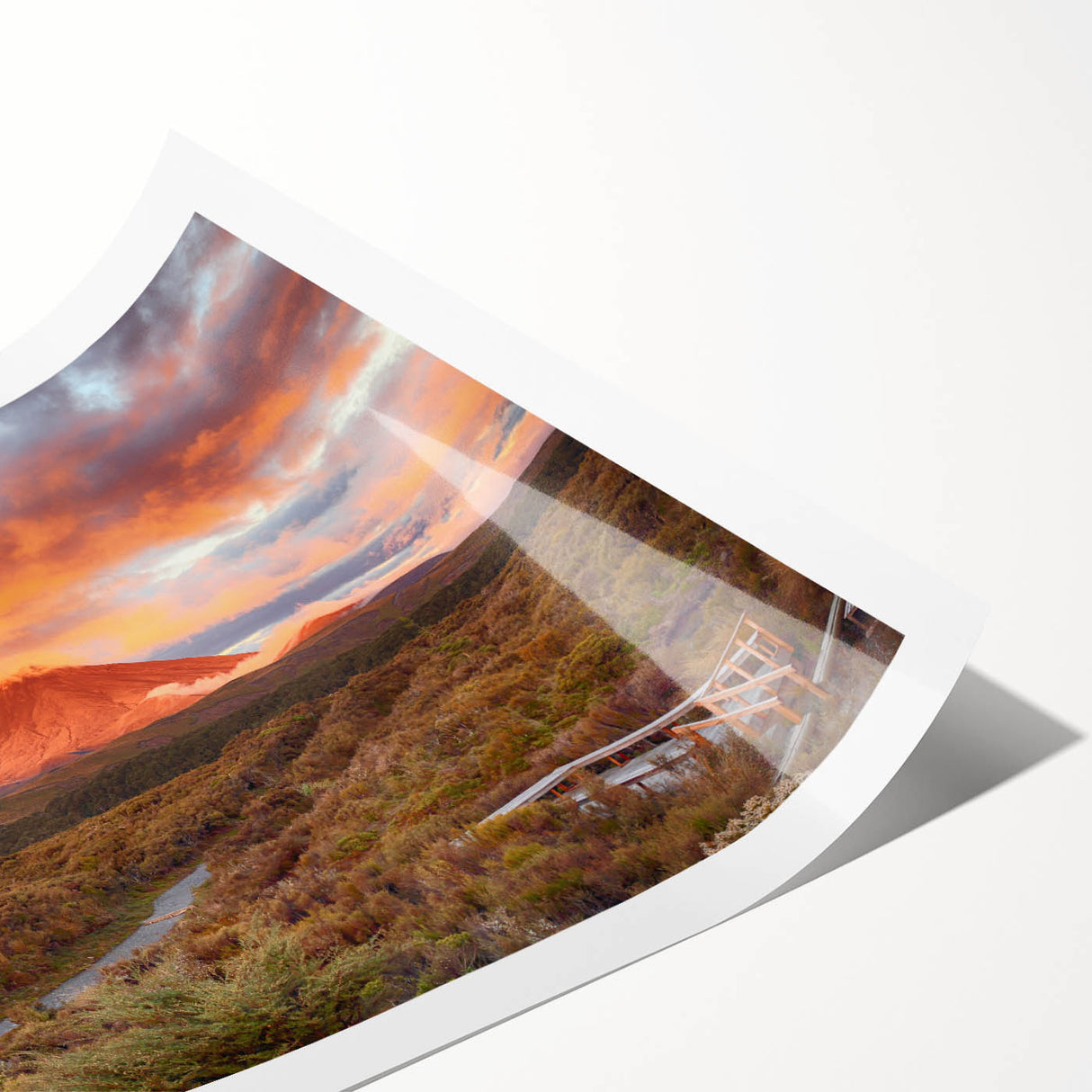 Vibrant rolled print of a volcanic landscape, showcasing dramatic colors and textures, ideal for home decor or art enthusiasts, packaged securely for delivery.