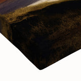 Close-up of a vibrant stretched canvas featuring a dramatic volcano landscape design, showcasing rich colors and intricate details ideal for modern home decor.