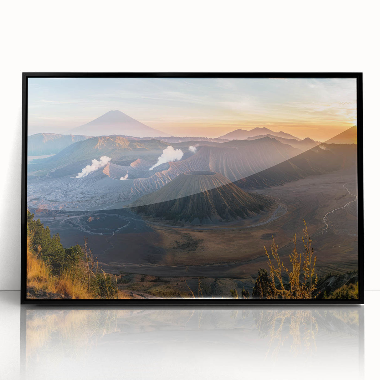 Framed wall art showcasing a dramatic volcano landscape design, featuring vibrant colors and a sleek black frame, perfect for modern home decor.