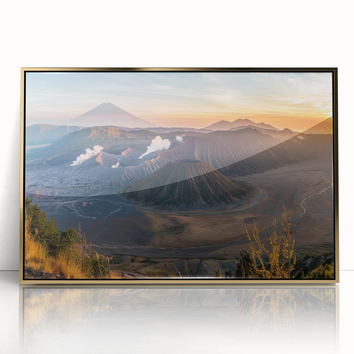 Framed acrylic wall art collection featuring a vibrant volcano landscape design with gold accents, ideal for modern home decor. The artwork showcases rich colors and dynamic textures, enhancing any living space. Perfect for art enthusiasts seeking a striking focal point.