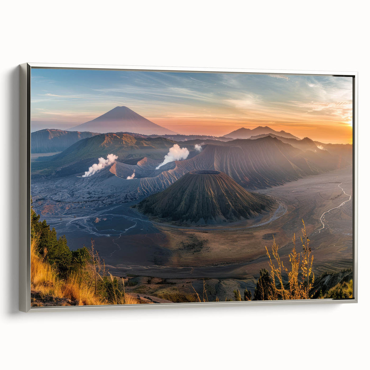 Framed canvas wall art showcasing a detailed landscape design of a volcano, highlighted with vibrant colors and a silver frame, ideal for home decor.