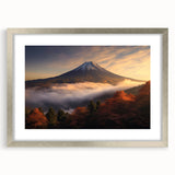 Framed silver wall art featuring a vibrant landscape design of a volcano, showcasing deep colors and intricate details, perfect for modern home decor.
