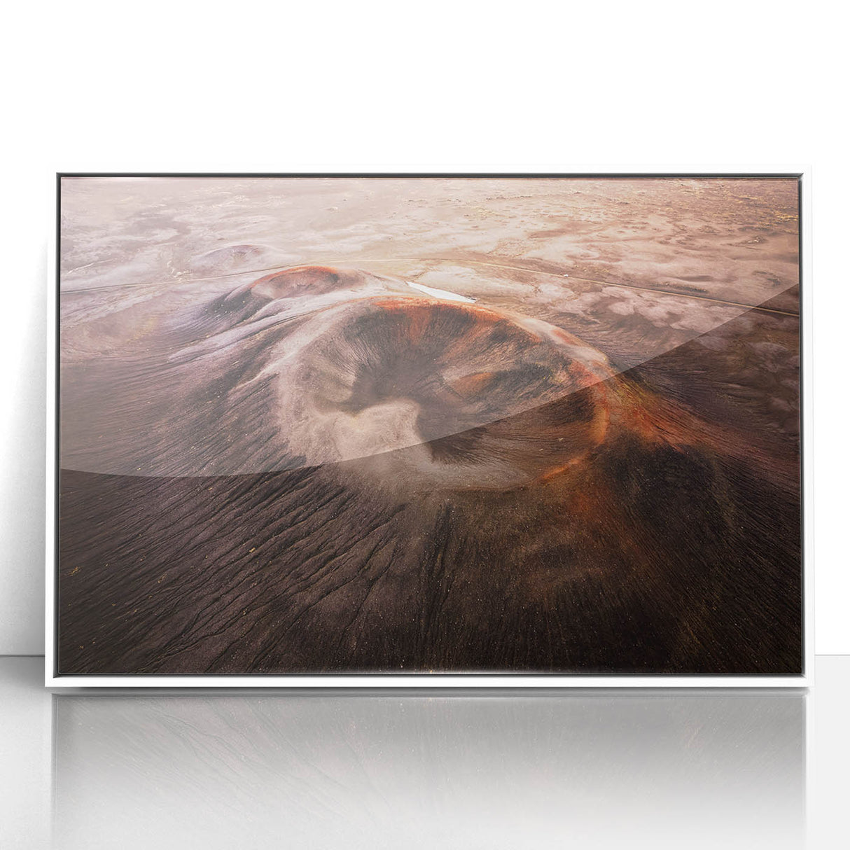 Framed acrylic wall art featuring a vibrant volcano landscape design, set in a sleek white frame, perfect for home decor and enhancing interior aesthetics.