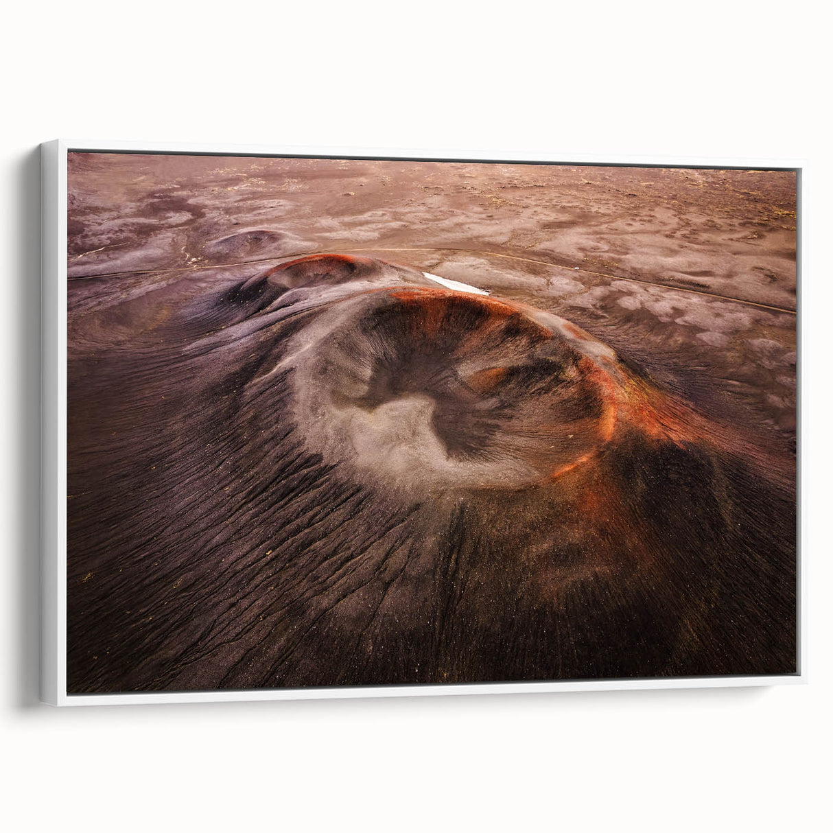 Framed canvas wall art depicting a vibrant volcano landscape with bold colors, set against a white background, perfect for enhancing modern interior decor.