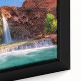 Framed canvas artwork showcasing a vibrant landscape waterfall design with lush greenery and flowing water, perfect for enhancing home decor and interior aesthetics.