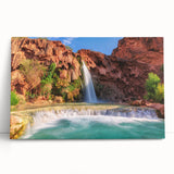 Stretched canvas wall art showcasing a serene waterfall landscape, featuring vibrant blue and green hues, perfect for home decor and nature enthusiasts.