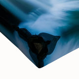 Close-up of a vibrant stretched canvas wall art featuring a serene waterfall landscape design, showcasing rich blue and green hues, perfect for home decor.