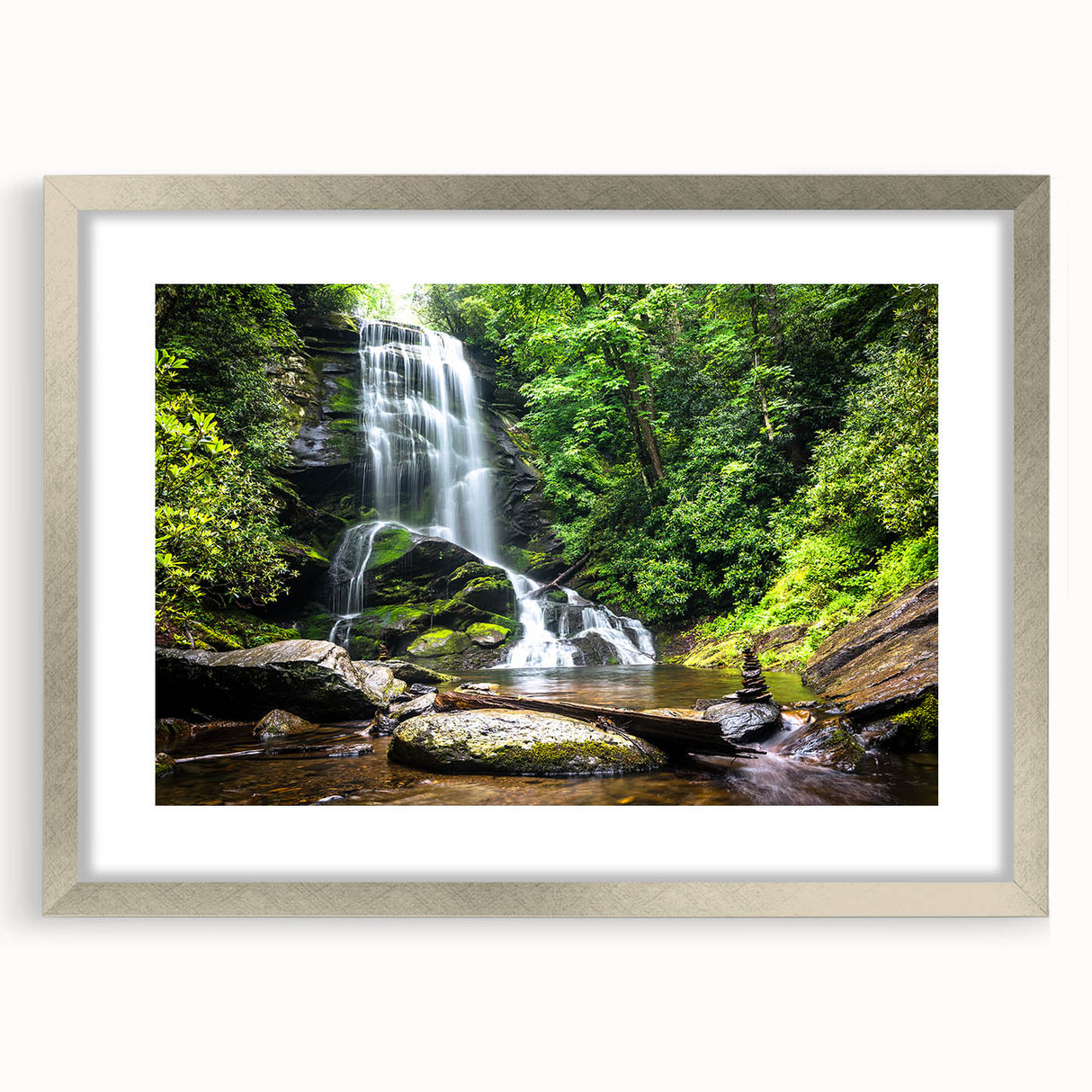 Framed wall art design featuring a serene landscape of waterfalls in a silver frame with a mat, ideal for enhancing home decor and creating a calming atmosphere.