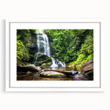 Framed landscape wall art showcasing a serene waterfall scene, accented by a white mat and sleek frame, perfect for home decor and nature lovers.