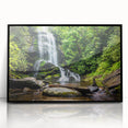 Framed wall art featuring a stunning waterfall landscape design with vibrant colors, set in a sleek black frame, ideal for enhancing home decor.