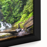 Framed canvas wall art showcasing a serene waterfall landscape with vibrant colors and intricate details, ideal for home decor enthusiasts looking to enhance their space.