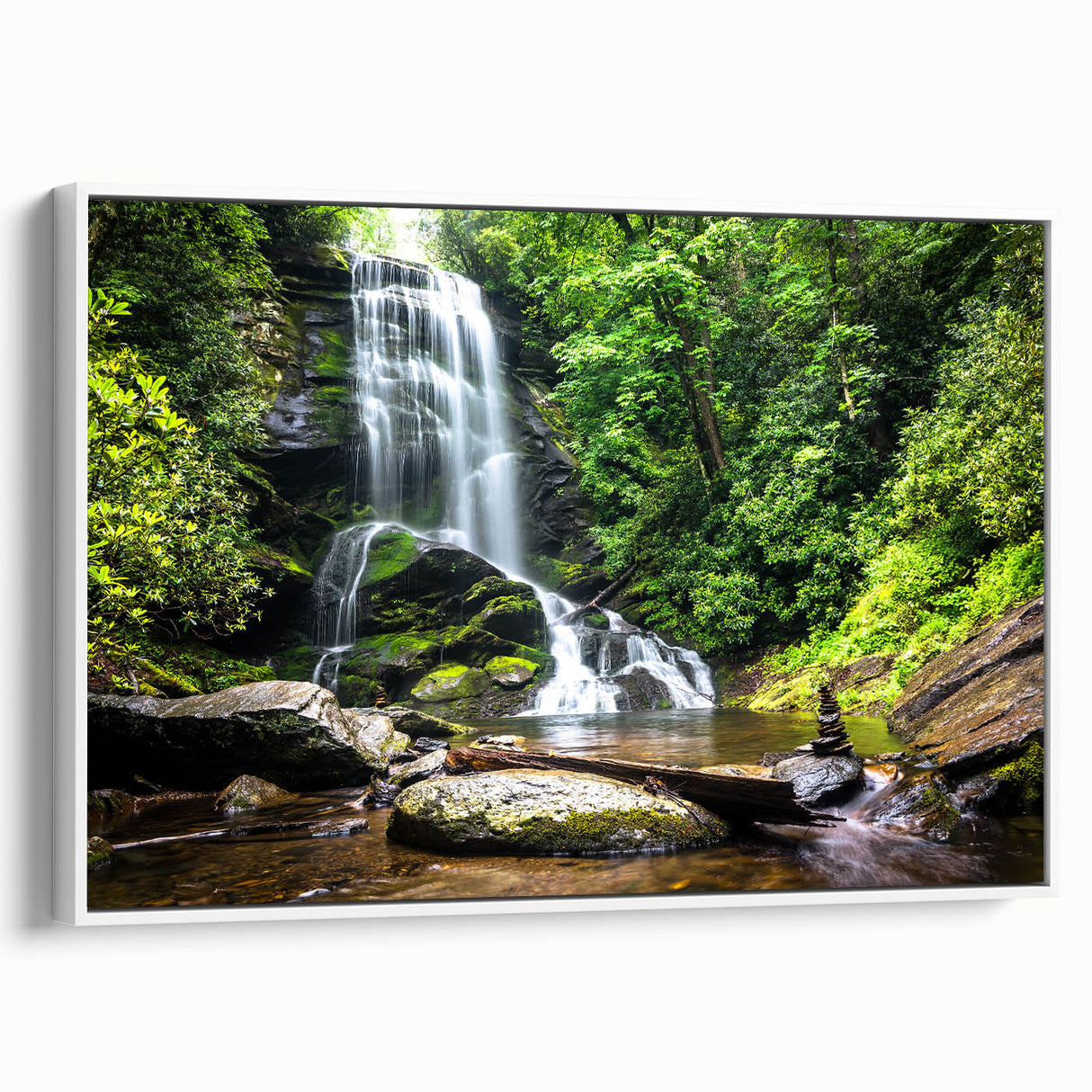 Framed canvas wall art displaying a serene waterfall landscape, featuring vibrant blues and greens, perfect for home decor in a contemporary setting.