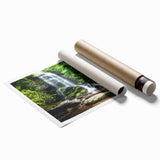 "Stunning wall art print showcasing a vibrant waterfall landscape design, featuring lush greenery and cascading water, rolled and ready for framing."