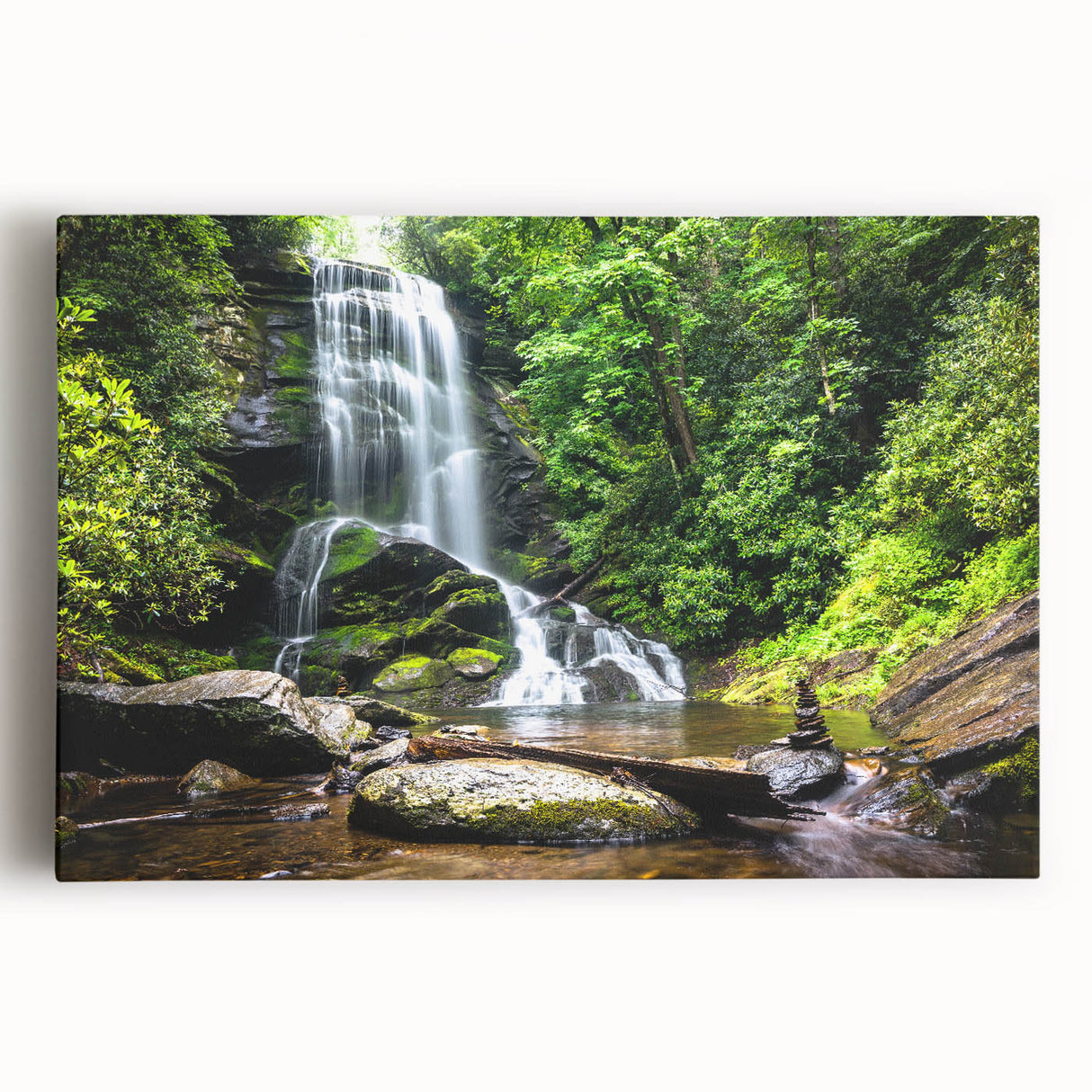 Stretched canvas wall art showcasing a vibrant landscape of cascading waterfalls, surrounded by lush greenery, perfect for nature-themed decor in living spaces.