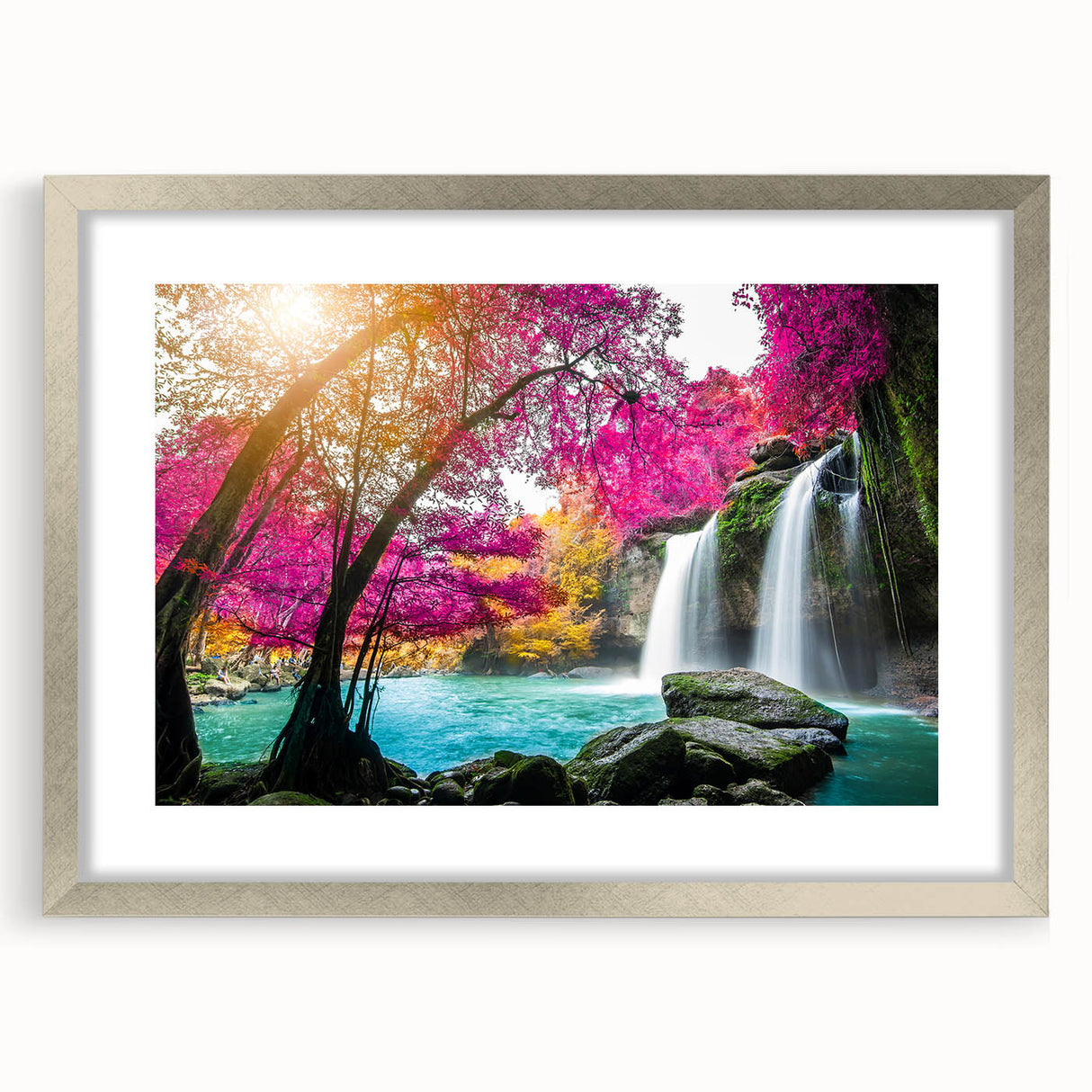 Framed wall art featuring a serene waterfall landscape design surrounded by a silver mat, ideal for home decor, enhancing ambiance with nature's beauty.