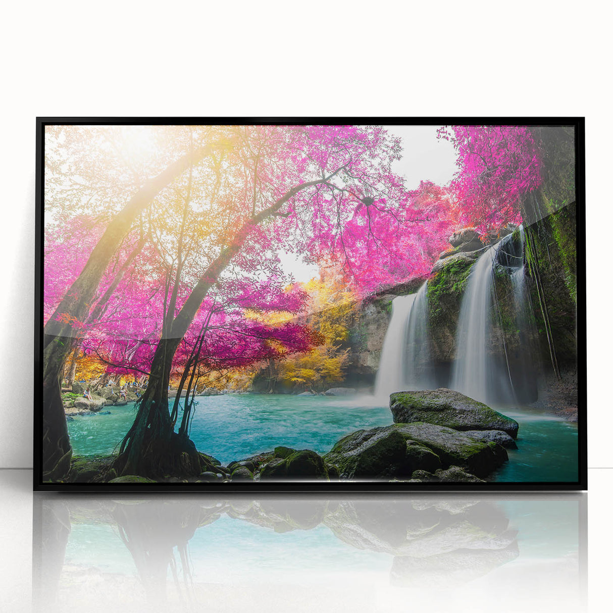 Framed acrylic wall art featuring a stunning landscape design of waterfalls, showcased in a sleek black frame, perfect for enhancing home decor with nature-inspired aesthetics.