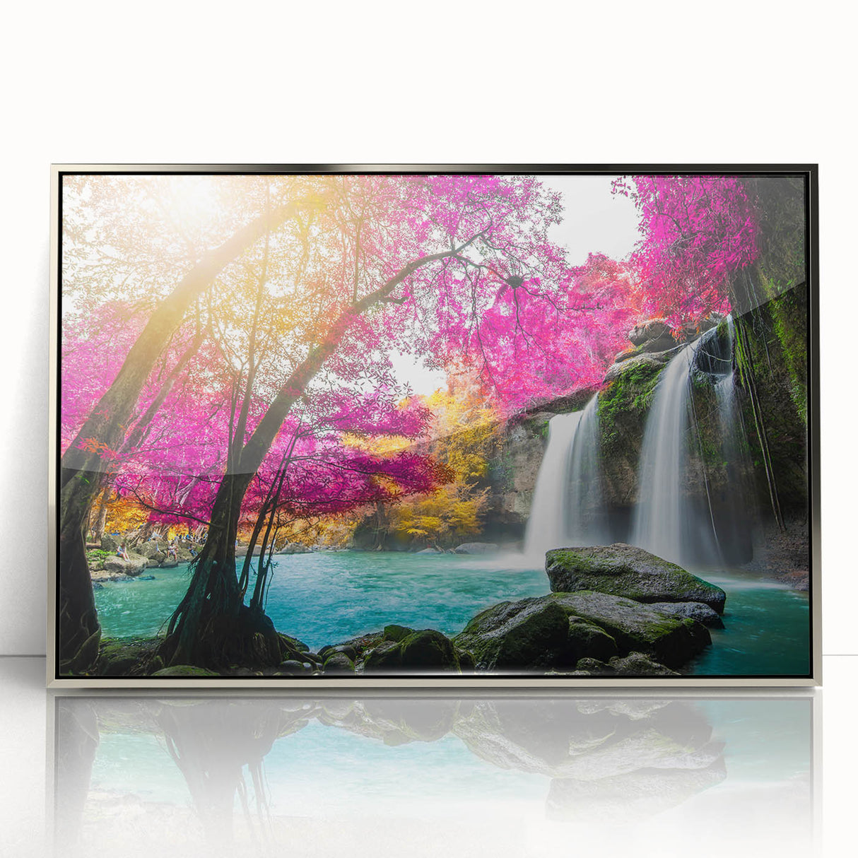 Framed acrylic wall art depicting a serene waterfall landscape, featuring vibrant greens and cascading water, ideal for enhancing home decor with a natural theme.