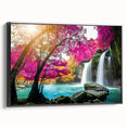 Framed wall art featuring a stunning landscape with cascading waterfalls, set against a vibrant natural backdrop. The canvas is elegantly framed in black, enhancing the overall aesthetic appeal and making it a perfect decorative piece for home or office environments.