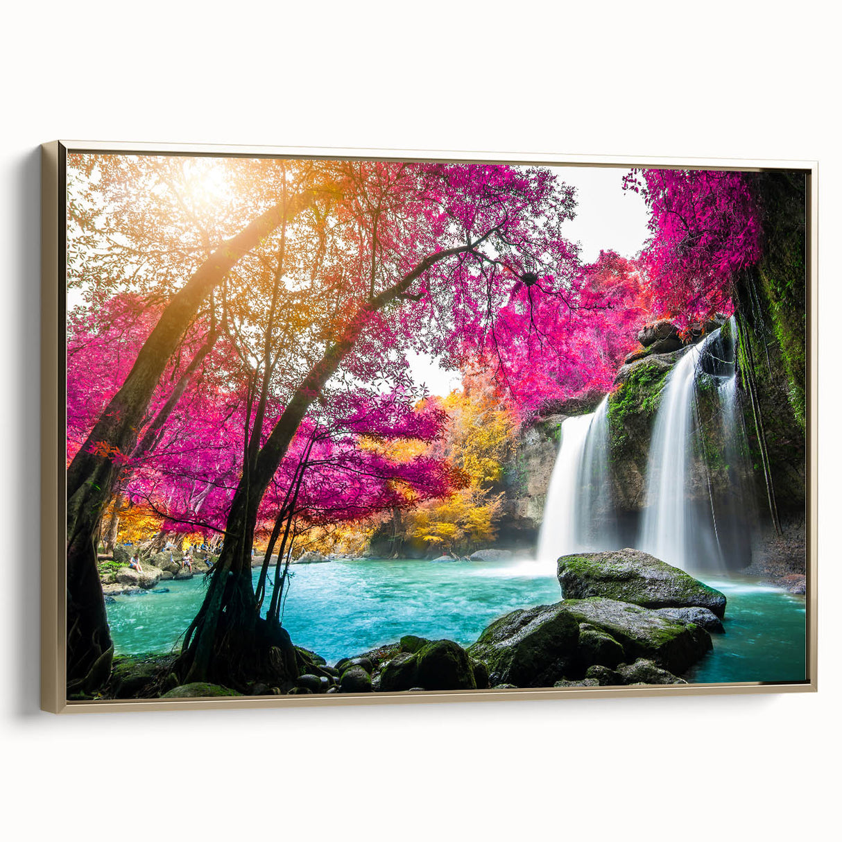 Framed canvas wall art showcasing a serene waterfall landscape in vibrant colors, accented with a gold frame, ideal for home decor and interior design.