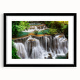 Framed wall art collection showcasing a serene waterfall landscape, featuring a black frame with matting, ideal for enhancing home decor and creating a tranquil atmosphere.