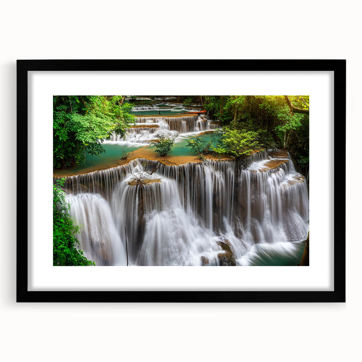Framed wall art collection showcasing a serene waterfall landscape, featuring a black frame with matting, ideal for enhancing home decor and creating a tranquil atmosphere.