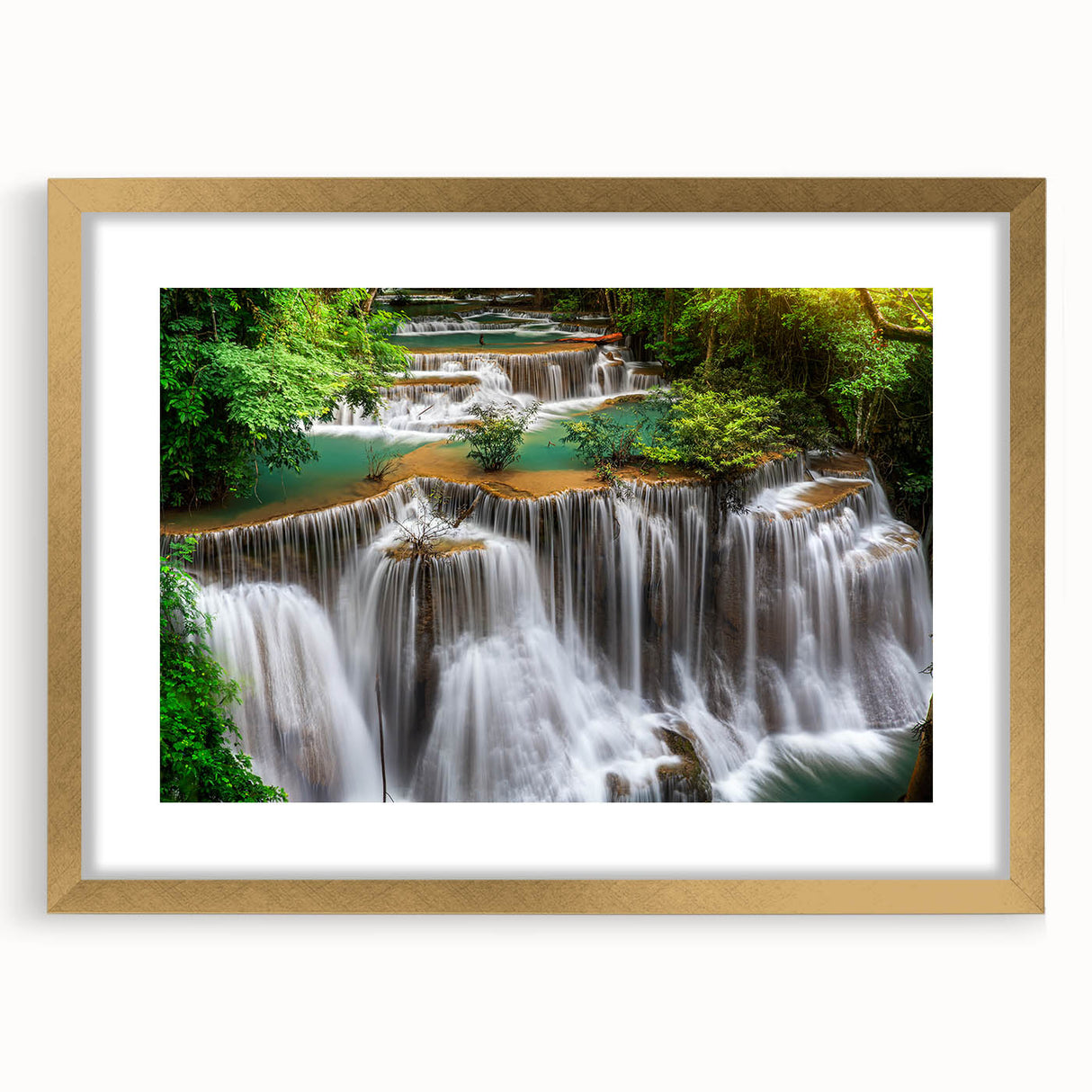 Framed wall art collection showcasing a scenic waterfall landscape design with a gold mat, perfect for enhancing home decor in modern interiors.