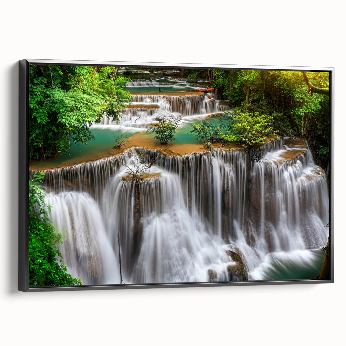 Framed canvas art showcasing a serene waterfall landscape design, featuring vibrant colors and detailed textures, presented in a sleek black frame for a modern touch. Ideal for enhancing home decor with nature-inspired elegance.
