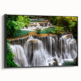Framed canvas art showcasing a serene waterfall landscape design, featuring vibrant colors and detailed textures, presented in a sleek black frame for a modern touch. Ideal for enhancing home decor with nature-inspired elegance.