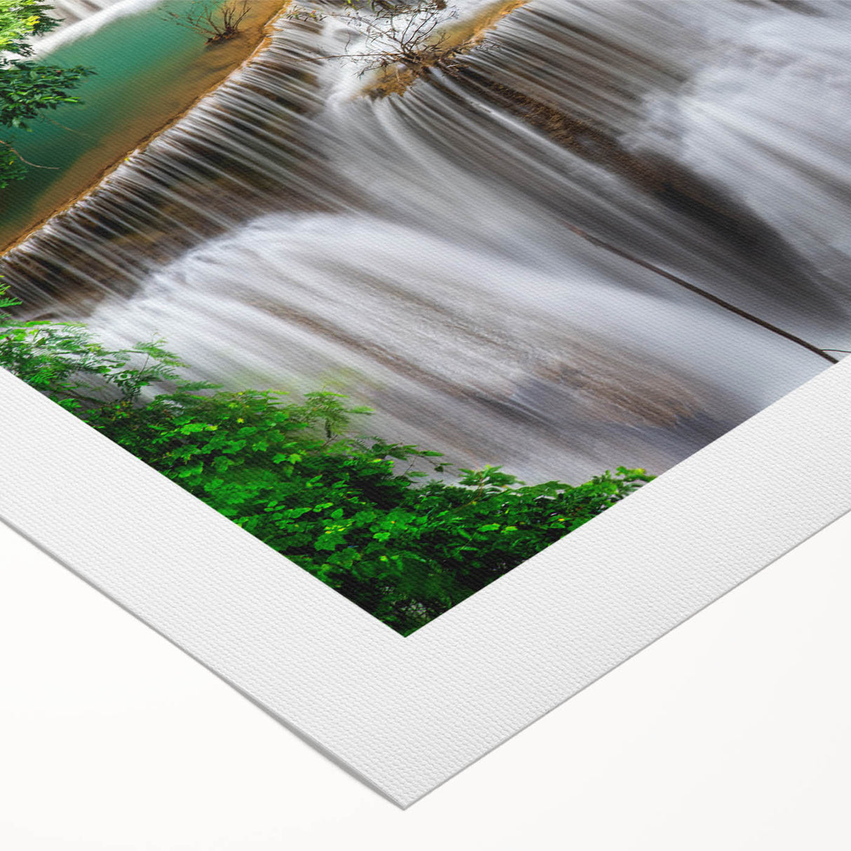 Vibrant rolled canvas wall art showcasing a stunning waterfall landscape design, featuring lush greenery and cascading water, perfect for home décor enhancement.
