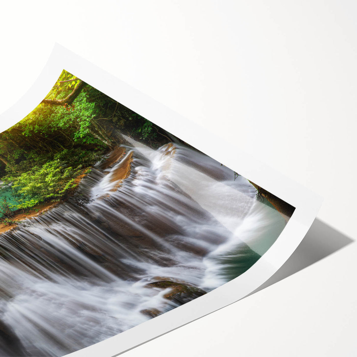 Vibrant rolled print showcasing a stunning waterfall landscape, perfect for home decor, featuring rich blues and greens, elegantly packaged in a protective tube.