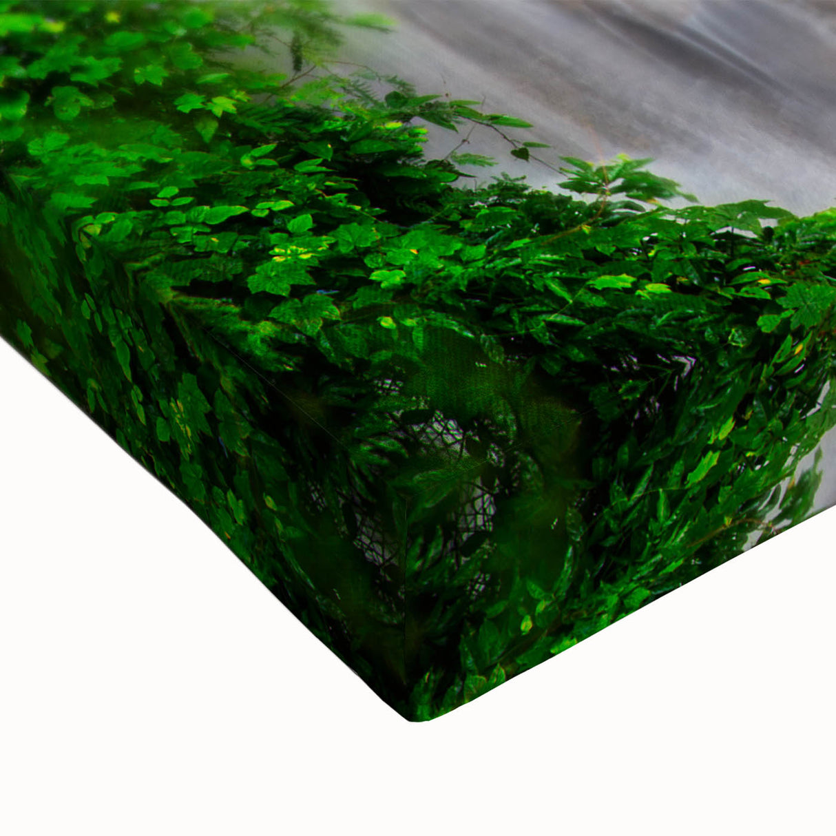 Close-up of a vibrant stretched canvas print showcasing a serene waterfall landscape design, featuring lush greenery and cascading water, perfect for home decor.