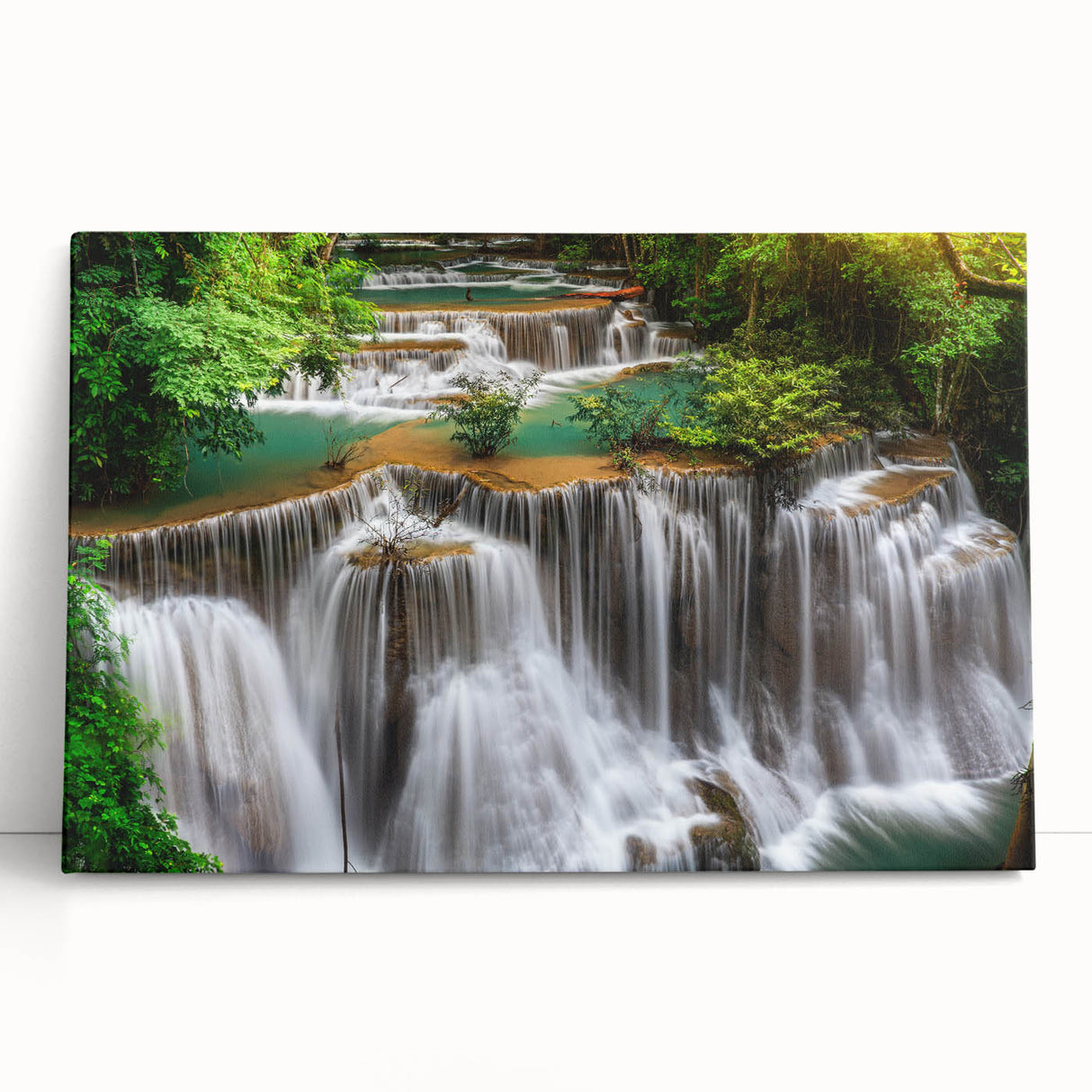 Stretched canvas wall art featuring a vibrant waterfall landscape design, showcasing lush greenery and flowing water, perfect for home decor enhancement.