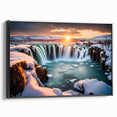 Framed wall art showcasing a serene landscape of cascading waterfalls on a canvas, with a sleek black frame highlighting the vibrant colors and intricate details of nature. Ideal for home décor enthusiasts seeking tranquility and style.