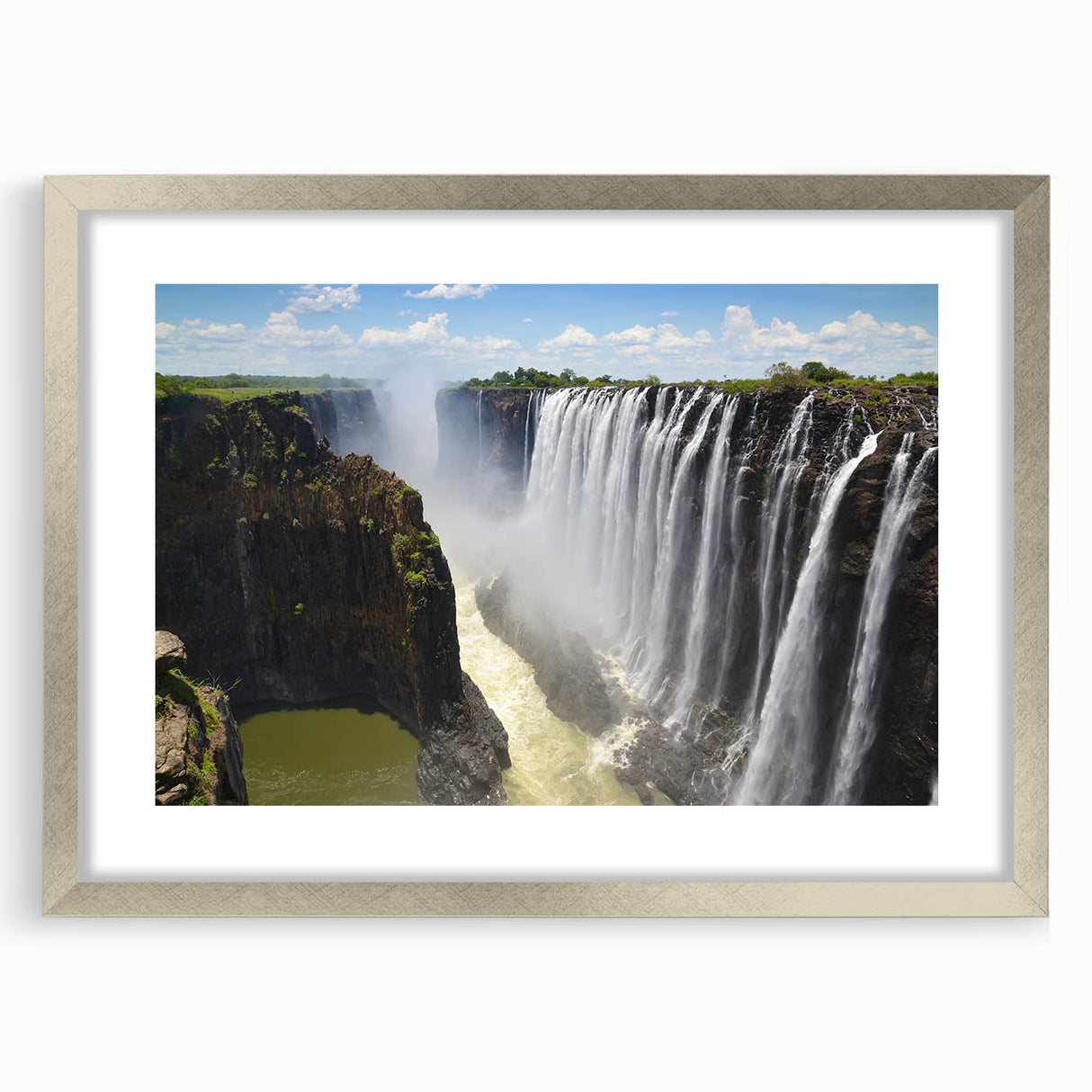 Framed wall art featuring a serene waterfall landscape design, set in a sleek silver frame with a white mat, perfect for home decor. This high-quality piece enhances any room's ambiance with its tranquil imagery.