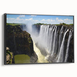 Framed canvas wall art depicting a serene waterfall landscape, showcasing vibrant blues and greens, with a sleek black frame enhancing its modern aesthetic. Ideal for nature lovers and home decor enthusiasts.