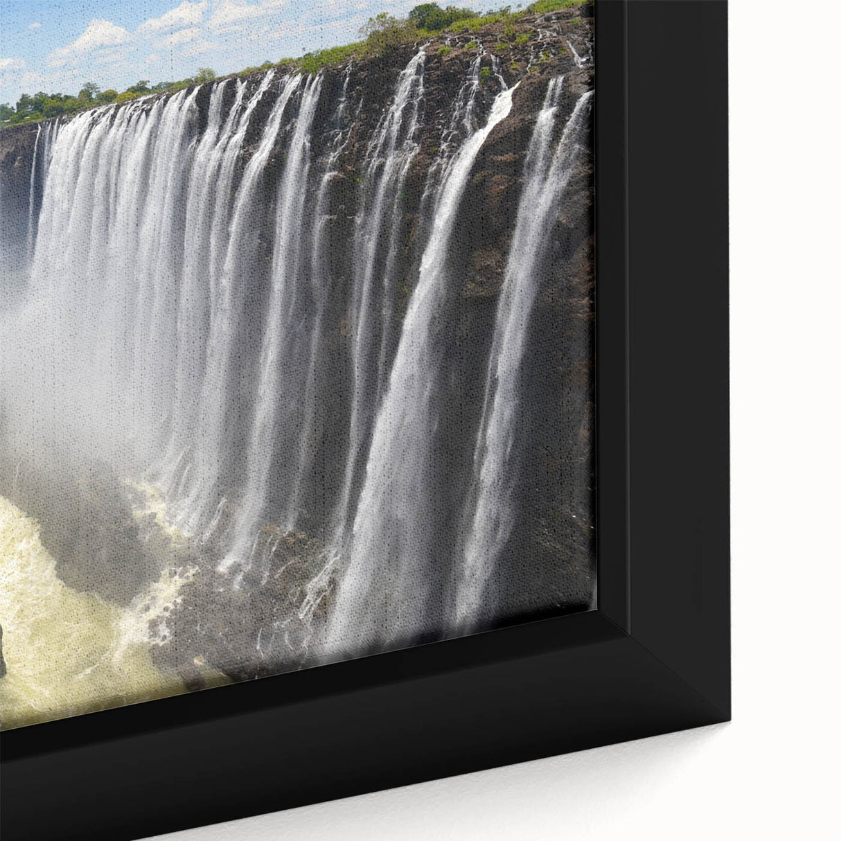 Framed canvas wall art showcasing a vibrant waterfall landscape design, with rich blues and greens, highlighting the serene beauty of nature in a modern setting.