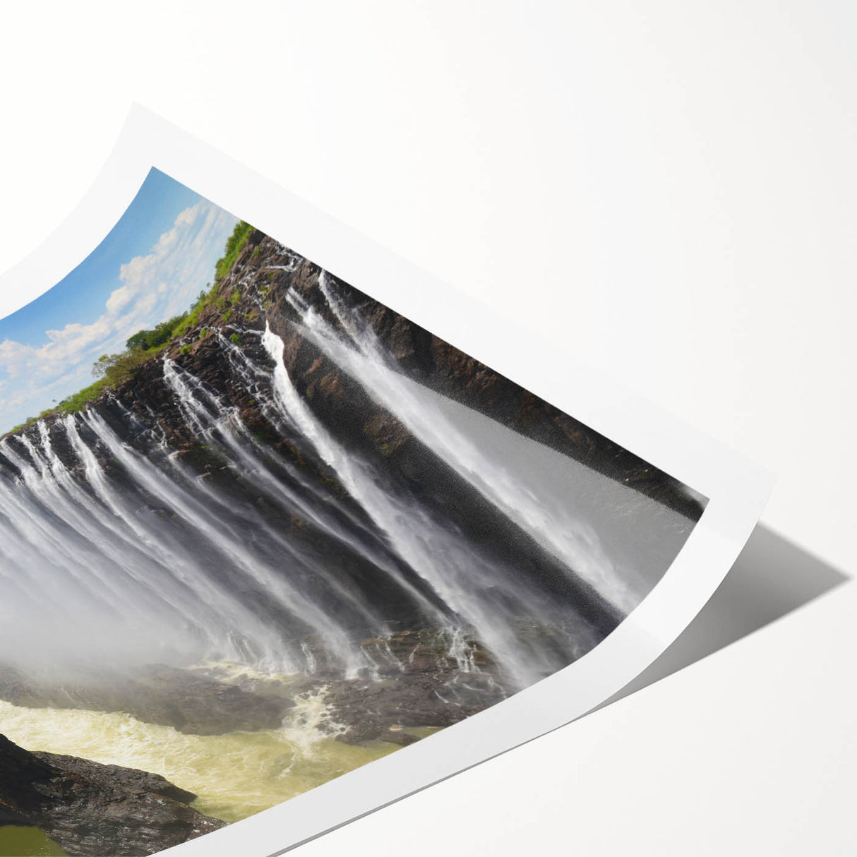 A beautifully rolled print of a serene waterfall landscape showcasing vibrant blues and greens, designed for wall art decoration, ideal for nature lovers.