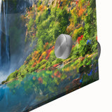 Close-up of a vibrant acrylic glass wall art piece showcasing a stunning waterfall landscape, featuring lush greenery and cascading water, perfect for home decor.