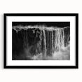Framed wall art featuring a stunning waterfall landscape design, showcasing vibrant blues and greens, set against a sleek black frame with a mat, ideal for home decor.