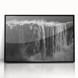 Framed wall art showcasing a serene waterfall landscape design, featuring vibrant blues and greens, encased in a sleek black frame, perfect for home decor.