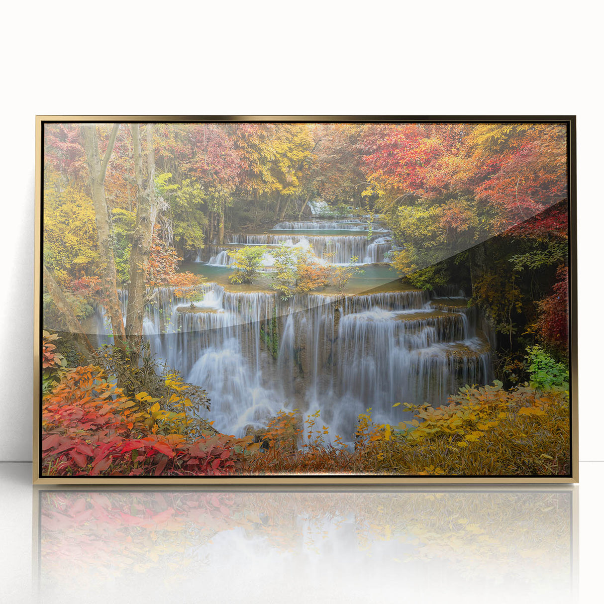 Framed acrylic wall art featuring a vibrant waterfall landscape with gold accents, ideal for home decor, adding a touch of elegance and nature-inspired beauty.
