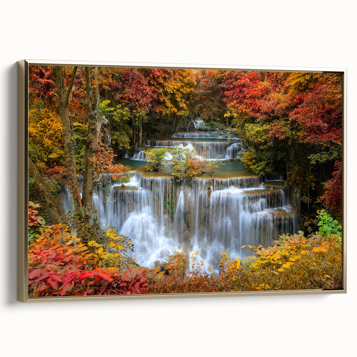 Framed canvas wall art showcasing a serene landscape with a waterfall, featuring lush greenery and gold accents, perfect for enhancing home decor aesthetics.