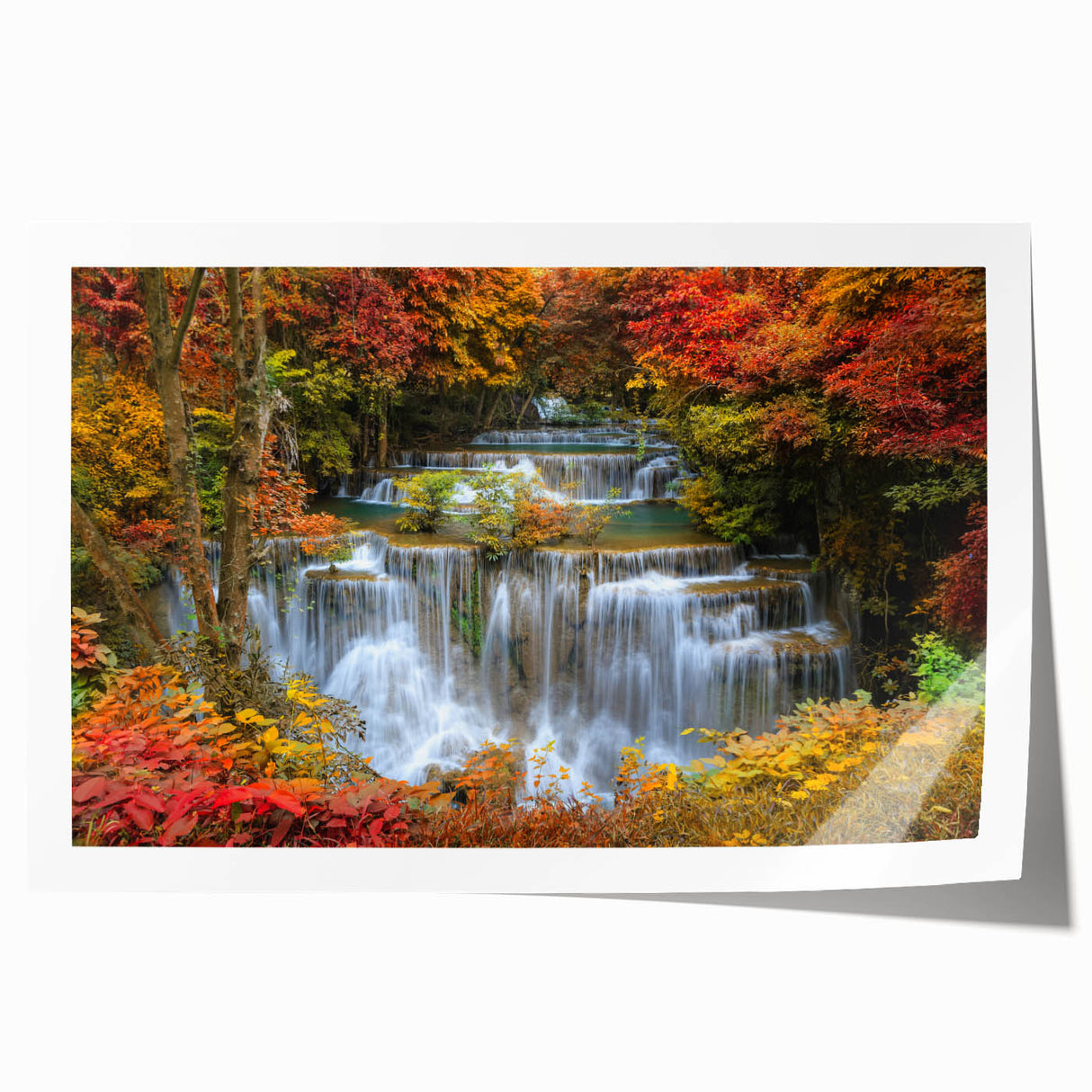 Vibrant rolled print showcasing a serene waterfall landscape, featuring lush greenery and cascading water, perfect for enhancing any home decor.