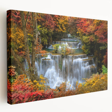 Stretched canvas wall art displaying a serene waterfall landscape in vibrant colors, ideal for home decor, enhancing tranquility in any room setting.