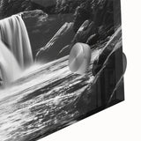 Close-up of a vibrant acrylic glass wall art piece showcasing a serene waterfall landscape, featuring lush greenery and cascading water, ideal for nature-themed decor.