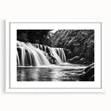 Framed wall art depicting a tranquil waterfall landscape design, featuring vibrant blues and greens in a sleek white frame with a mat, ideal for home decor.