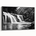 Framed canvas wall art featuring a serene waterfall landscape design, presented with a sleek black frame, ideal for enhancing home decor with nature-inspired aesthetics.
